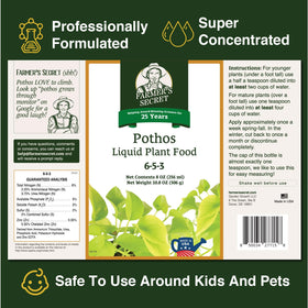 Farmer's Secret Pothos liquid fertilizer applied to soil, promoting vibrant leaf growth.