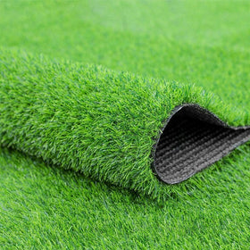 Fasmov green artificial grass rug on a deck; durable, low-maintenance outdoor surface