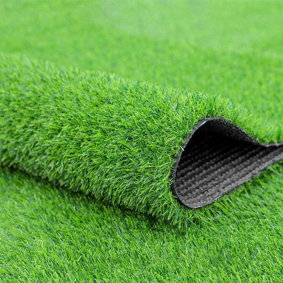 Fasmov green artificial grass rug on a deck; durable, low-maintenance outdoor surface
