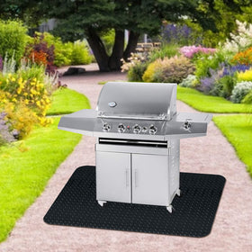 Fasmov grill mat being rinsed with hose for easy cleaning