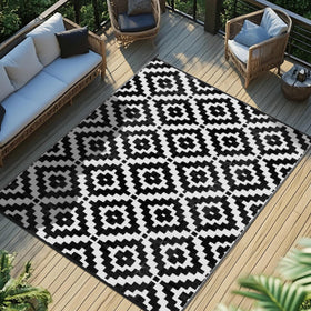 Favoyard outdoor rug 5x8 waterproof on a sunny patio for durable outdoor living.