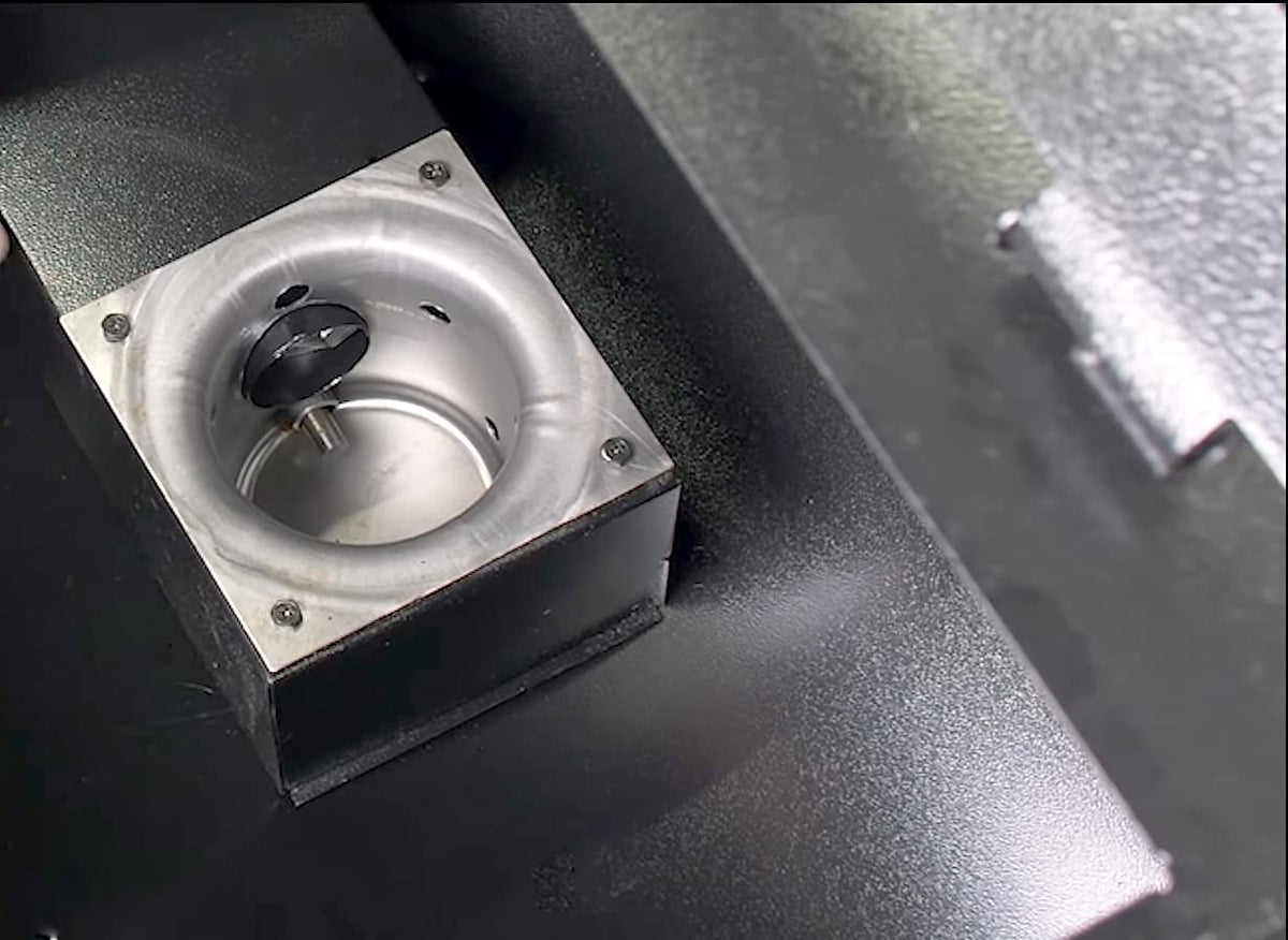 FCCUM fire burn pot on a Traeger grill demonstrates replacement part ready