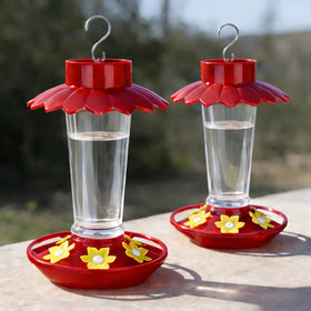 Fchstaer hummingbird feeder with red umbrella cover protecting nectar from sun and rain