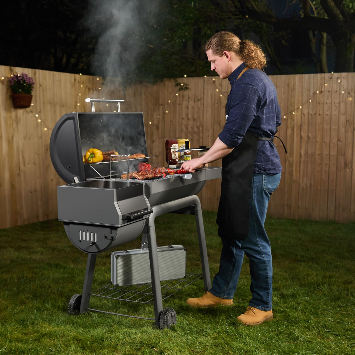 Feasto 815 sq in cooking space shown in outdoor backyard setup.