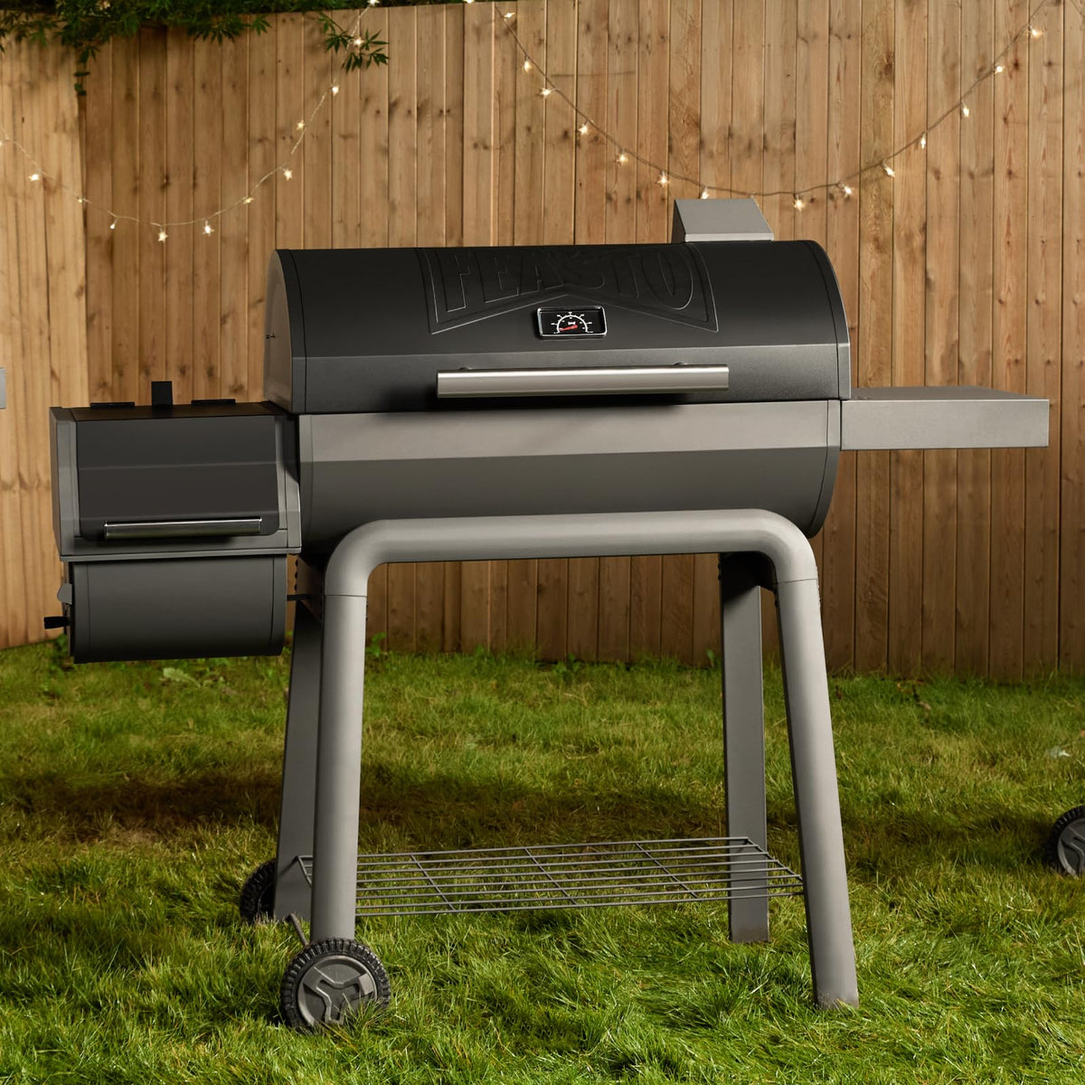 Feasto sturdy side table and hooks organize grilling tools during cooking.
