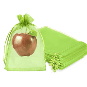 Fetanten fruit bags on tree protect apples from pests with breathable mesh.