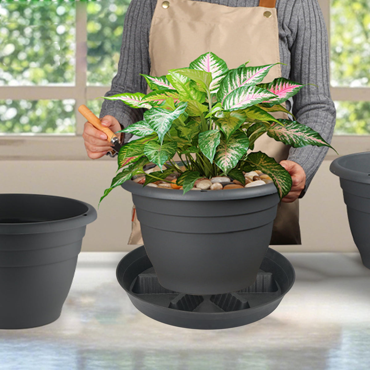 Feyvdzv heavy-duty plastic plant saucer resists warping.