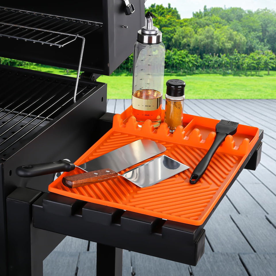 Find Law silicone tools mat on the griddle keeps utensils organized.