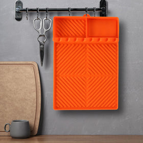 Find Law silicone mat in kitchen for ladles and spoons organization.