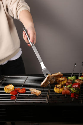 FIRBISI grill knife for precise slicing and prep during grilling.