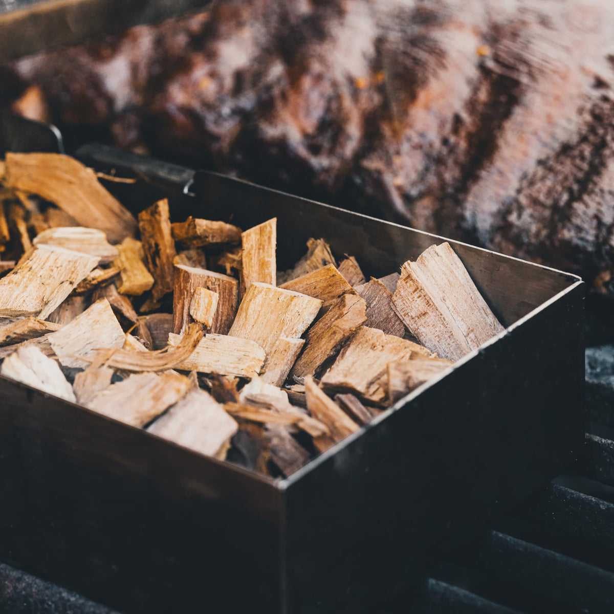 Fire & Flavor Hickory chips close-up highlights pure, bark-free composition for cleaner burning.