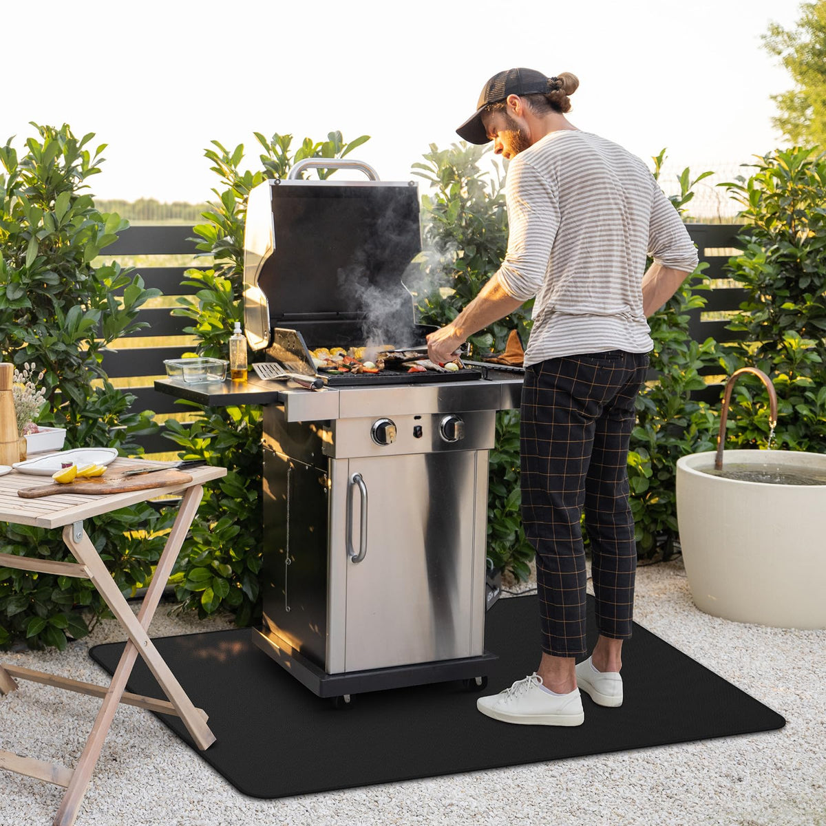 FireWESS fireproof grill pad under BBQ reduces embers and flare-ups.