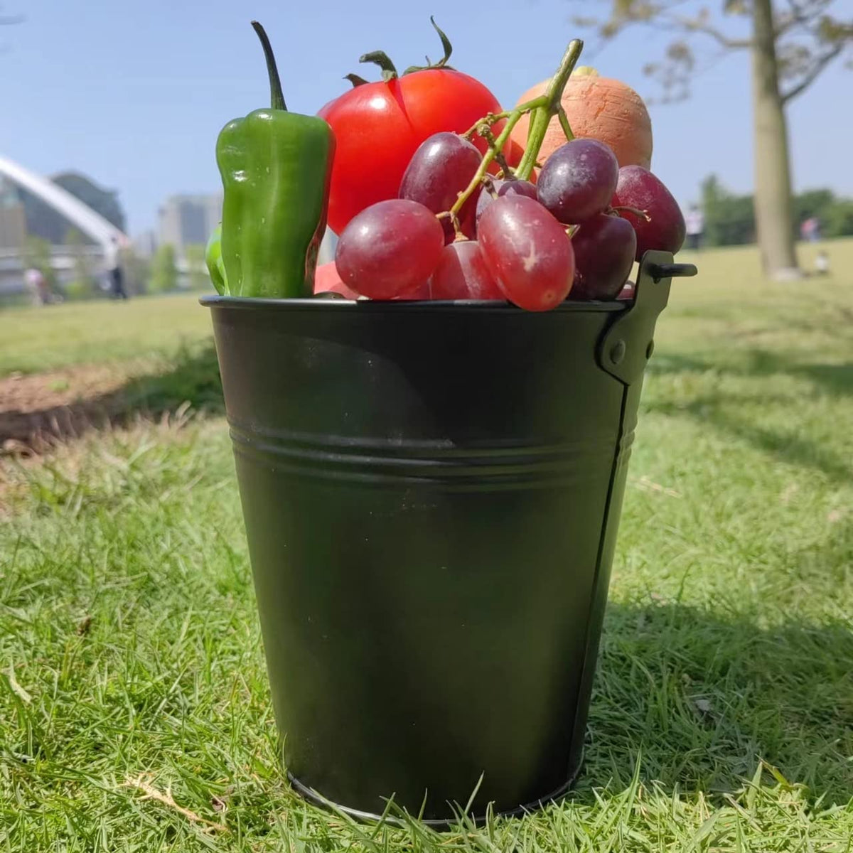 Firsgrill liner near grill for storing vegetables and fruit.