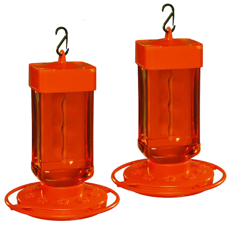 First Nature Oriole Feeder with 32-ounce reservoir and orange base, ideal for backyard birds.