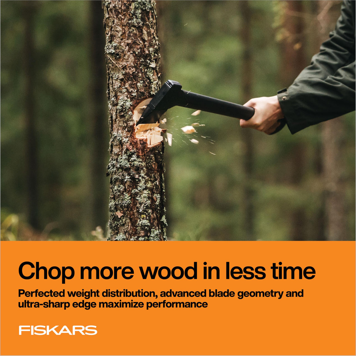 Low-friction coating on Fiskars axe aiding smooth wood cutting