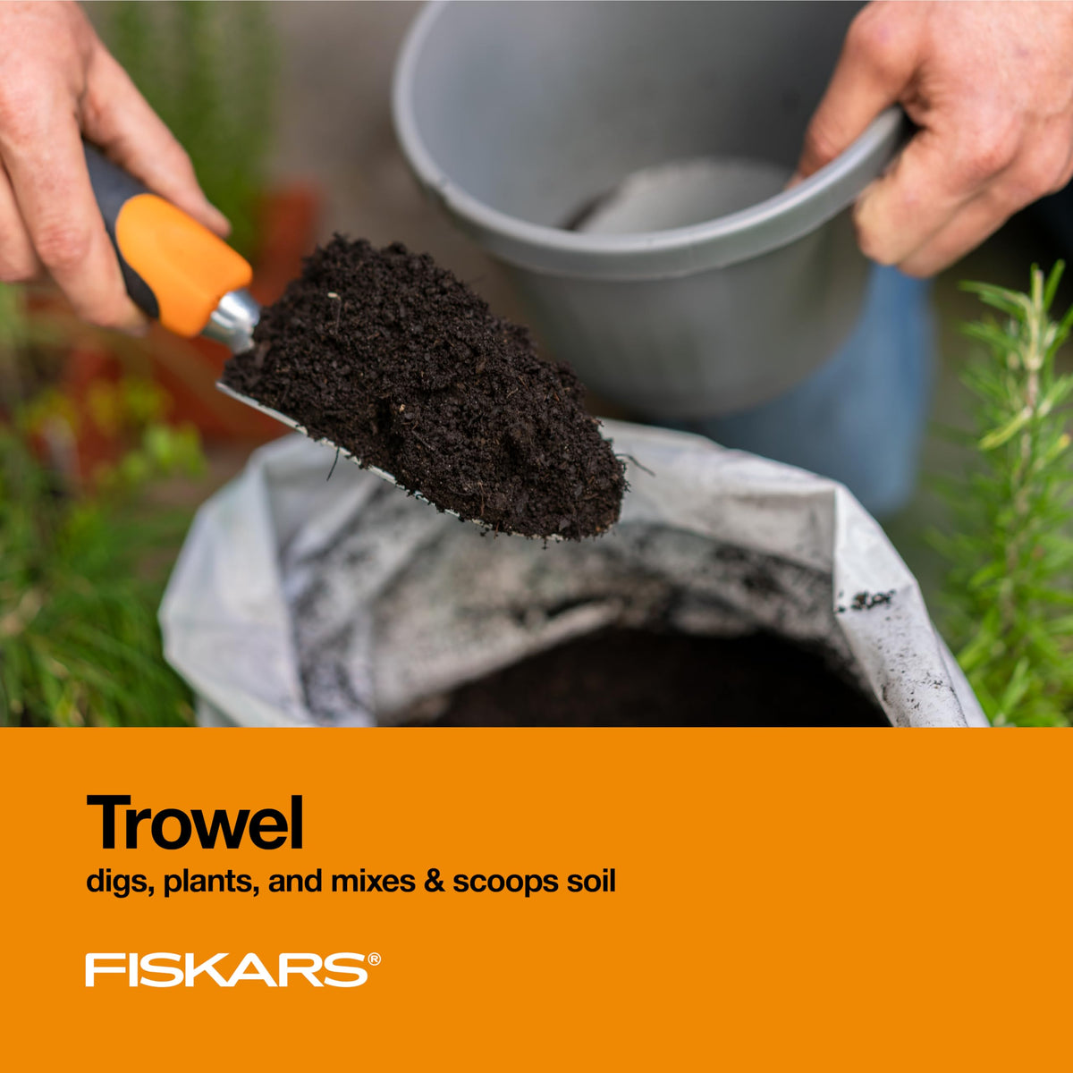 Fiskars cultivator in use to loosen soil and aerate beds.