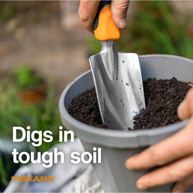 Fiskars Ergo Trowel digs through tough soil with precision.