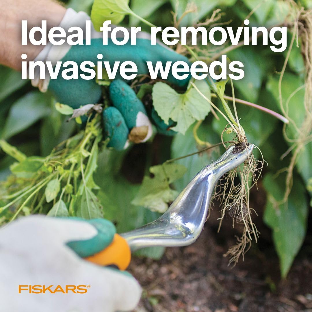 Fiskars Ergo Weeder angled design helps cut through turf for clean root removal.