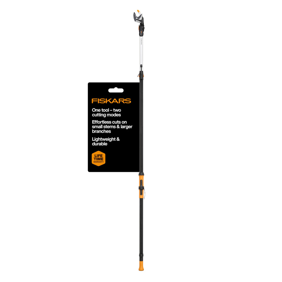 Fiskars extendable tree pruner reaching high branches with safe ground-level trimming