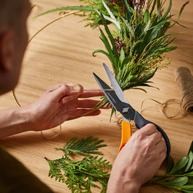 Fiskars Garden Scissors integrated tape cutter in sheath for quick repairs.