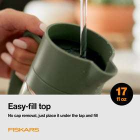 Fiskars Watering Carafe easy-fill top for quick refills under tap.