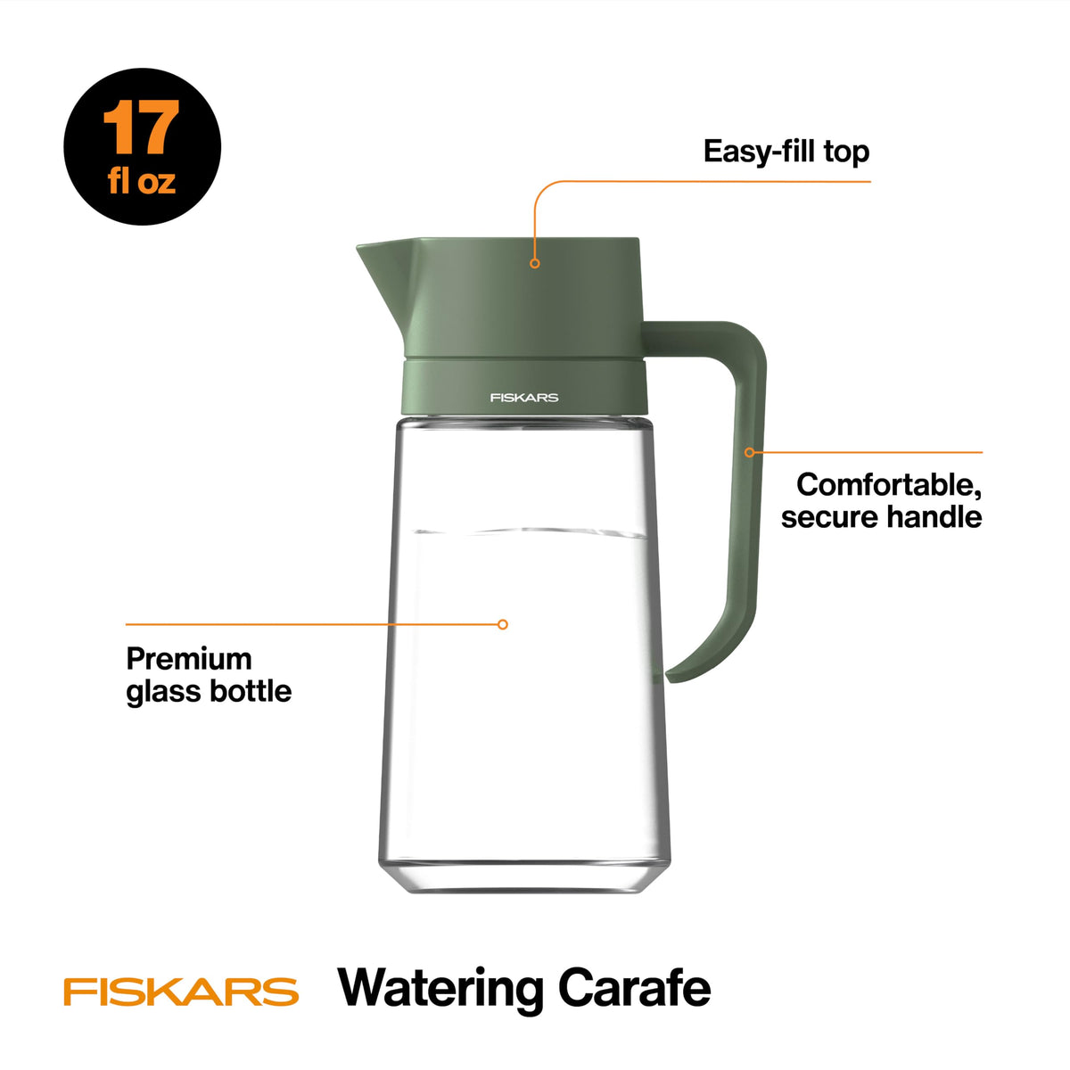 Fiskars Glass Watering Carafe with modern silhouette complements desk plants.