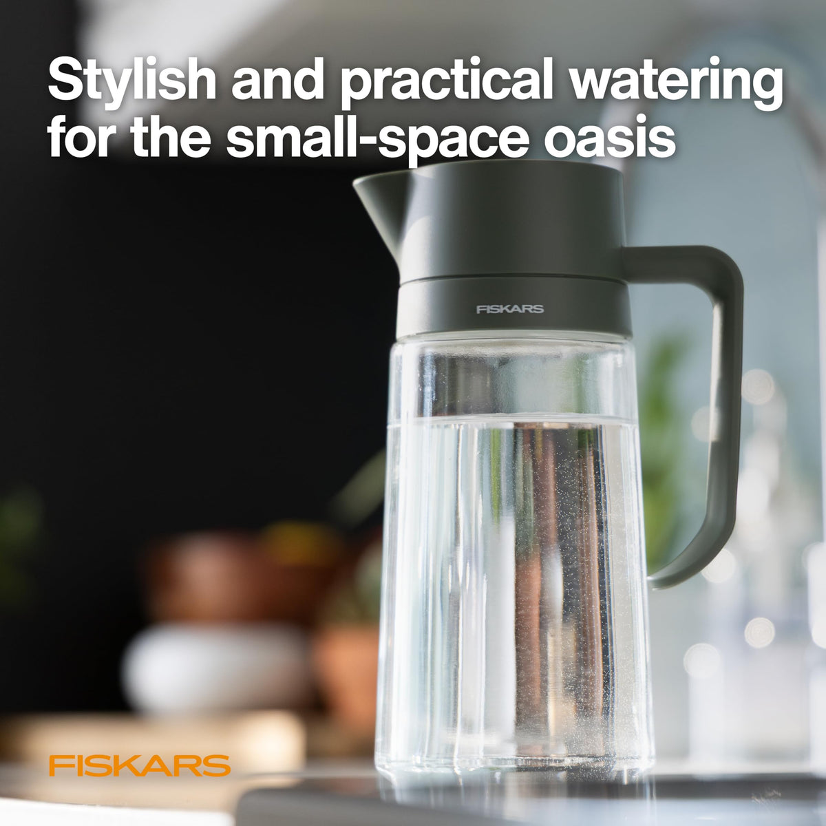 Fiskars Watering Carafe features precision spout for direct root-zone pouring.
