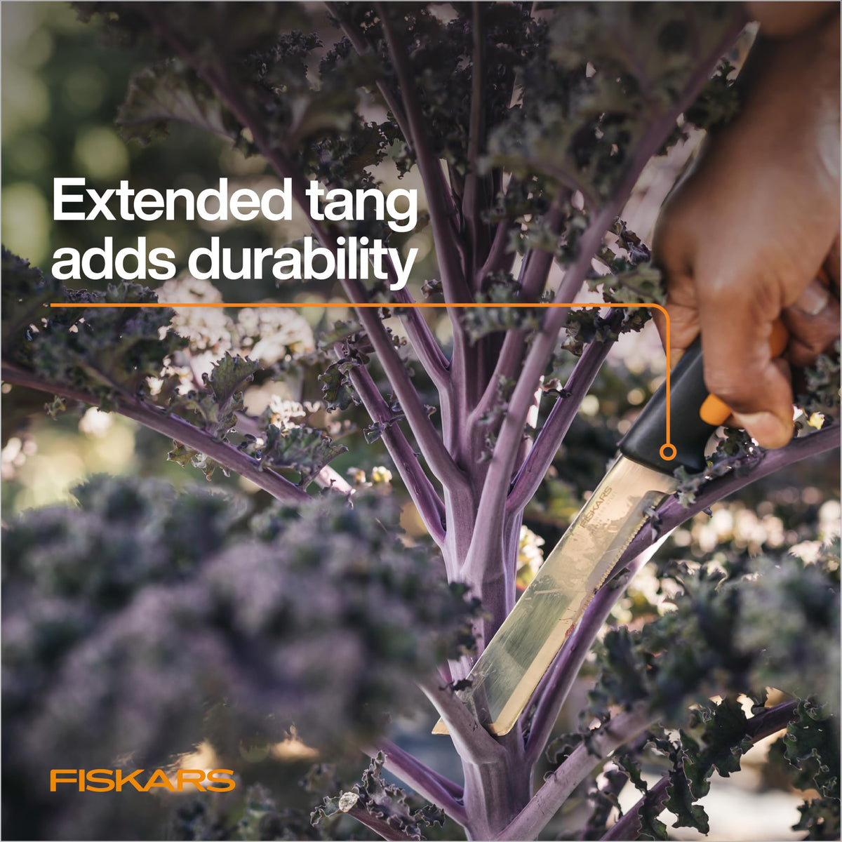 Fiskars Harvesting Knife belt-loop sheath shown for easy storage.
