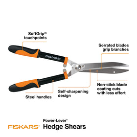 Fiskars Power-Lever hedge shears blades close-up, serrated edge grips branches for clean cuts.