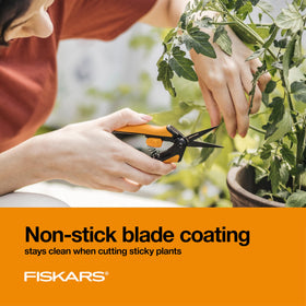 Fiskars pruning snips with softgrip handles for comfortable garden sessions.