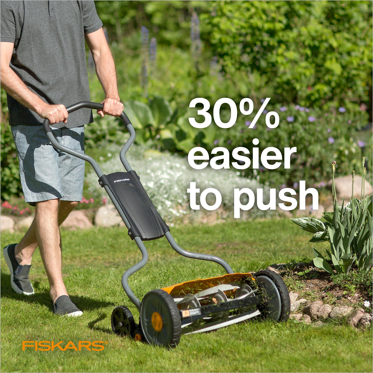 Fiskars mower with adjustable cutting height shown on a lawn for tailored results