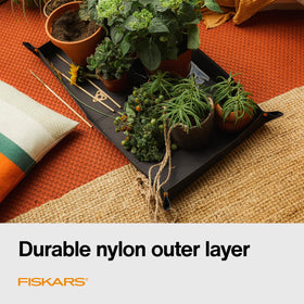 Fiskars repotting mat corner snaps form contained sides for mess control.