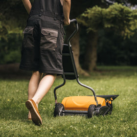 Fiskars StaySharp Max Reel Mower on a level lawn shows jam-free operation.