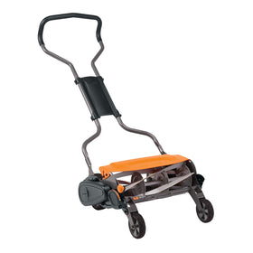 Fiskars StaySharp Max Reel Mower in action on a lush lawn, eco-friendly manual operation.