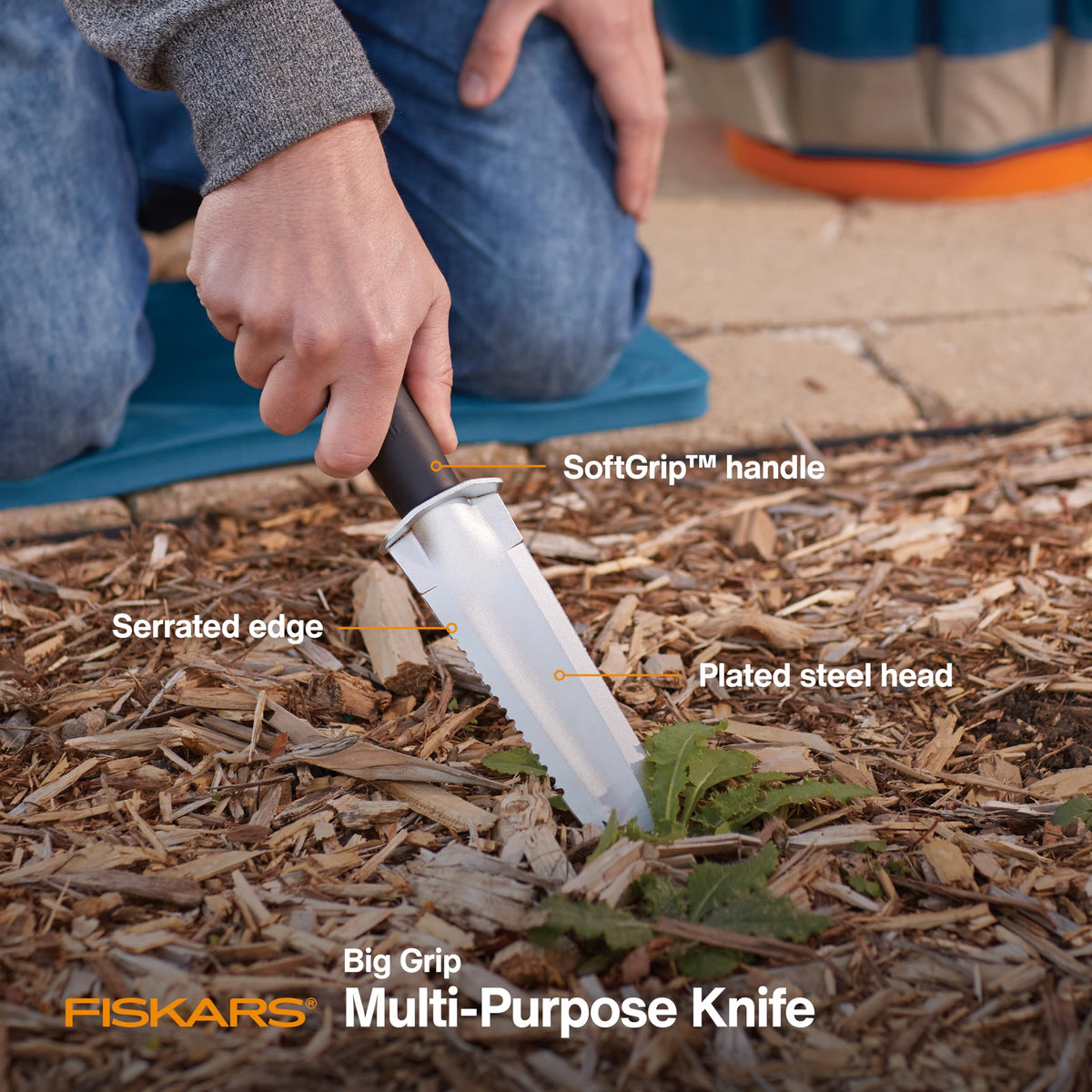 Fiskars Garden Knife serrated edge cuts through thick roots with ease.