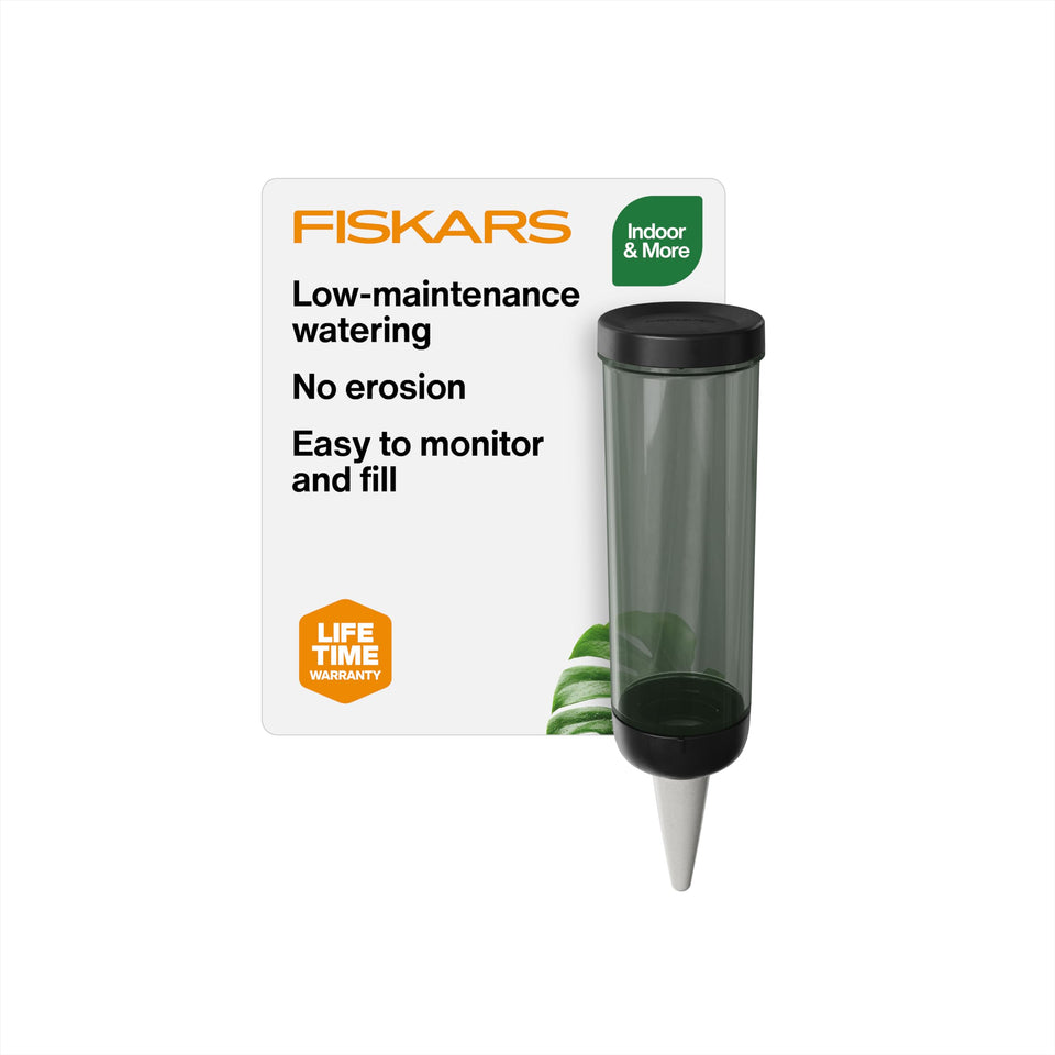 Fiskars Watering Spike with ceramic cone delivering steady moisture to indoor plant roots.