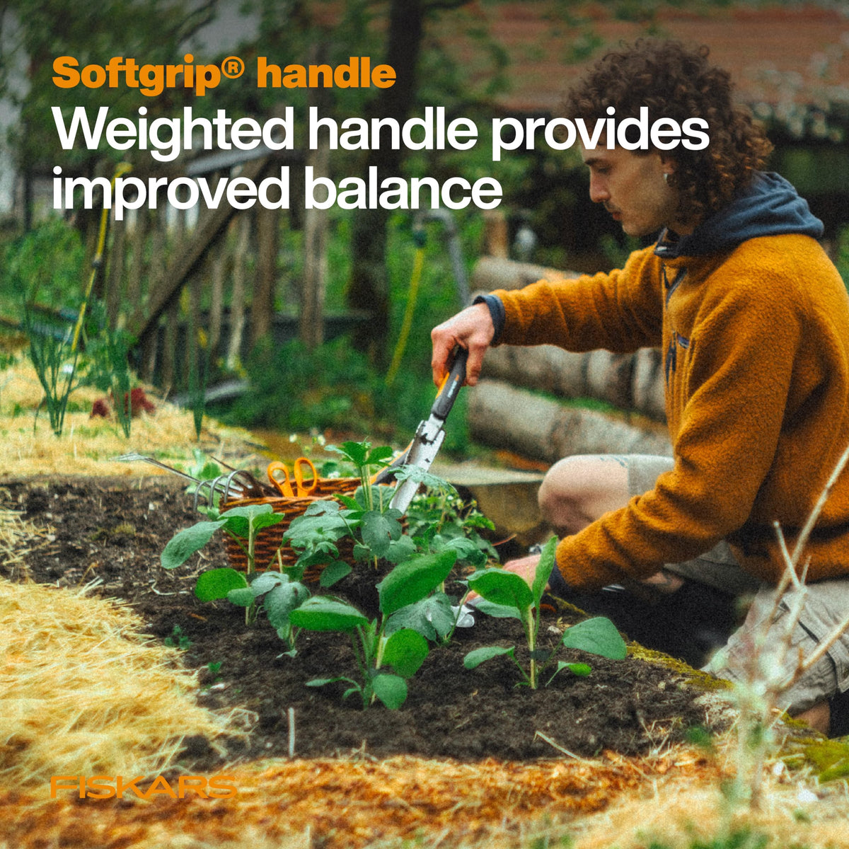 Fiskars Xact Weeder SoftGrip handle with multiple grip positions for comfortable use.