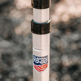 Flagpole-To-Go displays two flags at once for promotions.