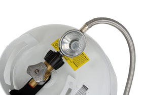 Flame King stainless steel braided hose shows weather-resistant durability outdoors.