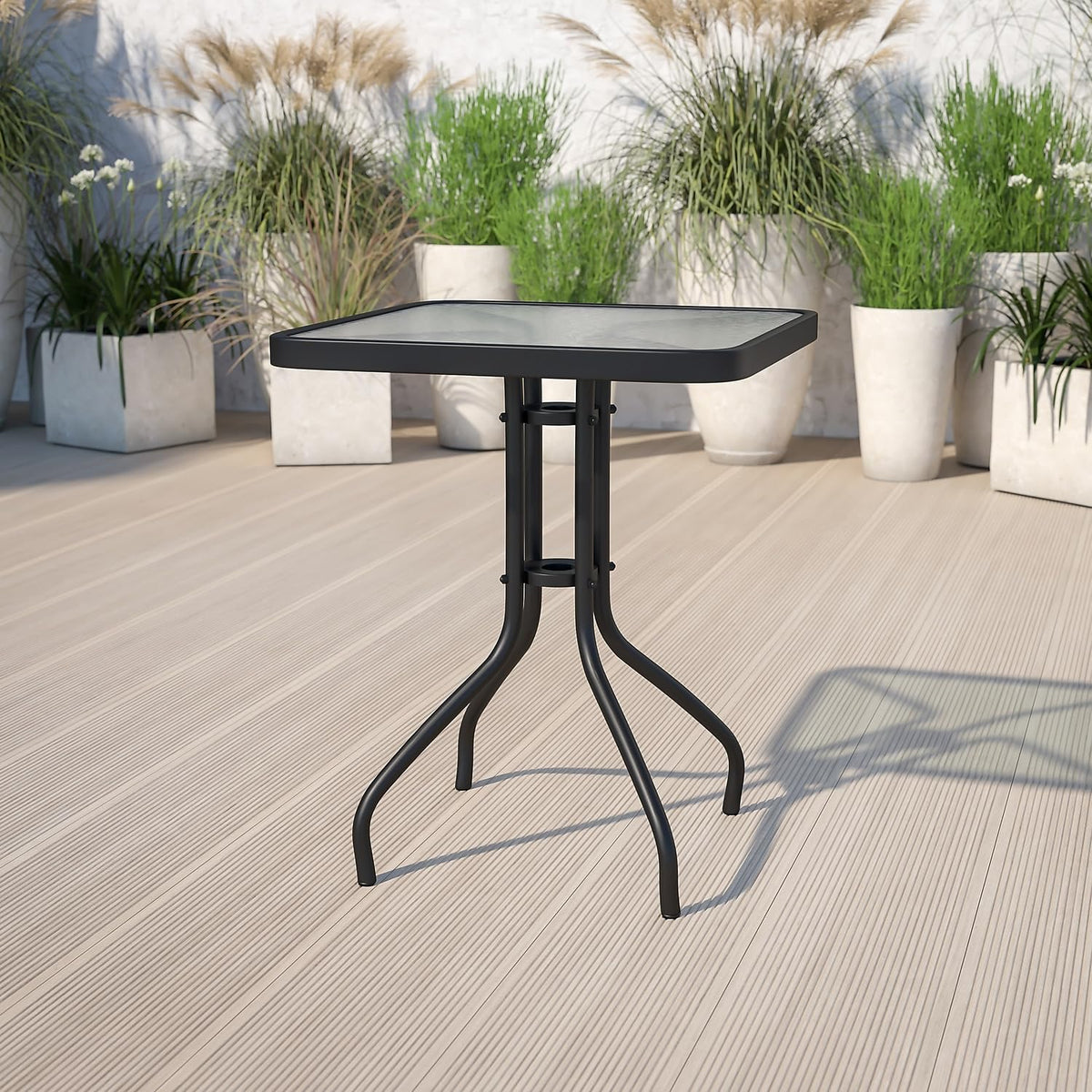 Powder-coated frame anchors Barker table on outdoor spaces.