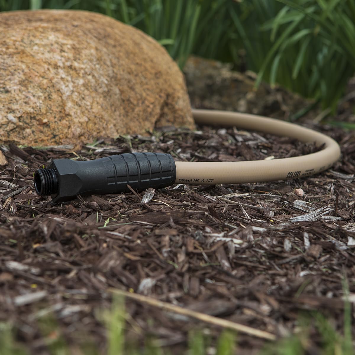 Flexzilla 10 ft brown mulch hose blends with landscaping and outdoor spaces.