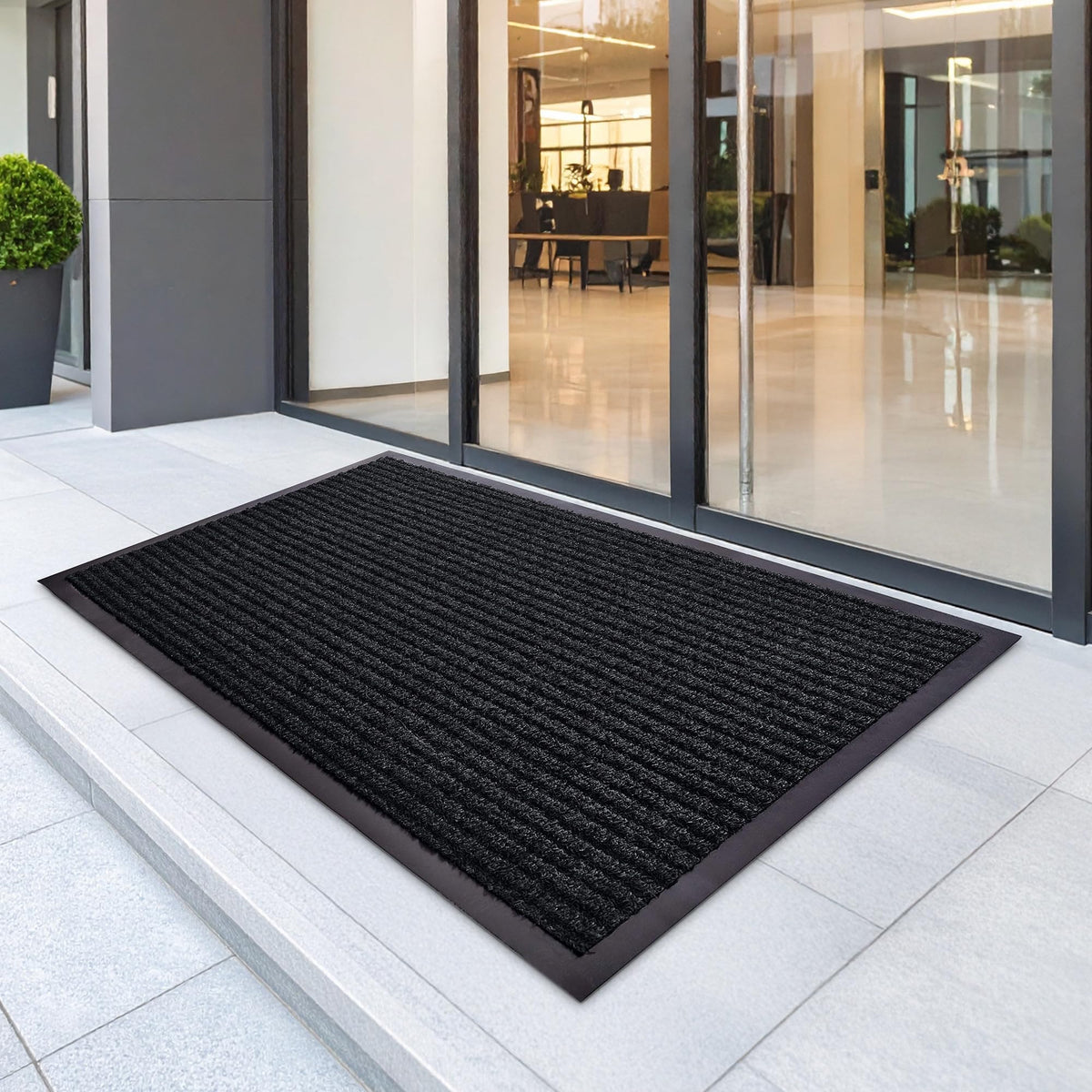 FloorGuard close-up texture of the charcoal mat, rugged durability.