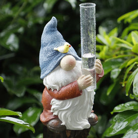 Forup resin gnome rain gauge with bird measures rainfall outdoors for garden planning.
