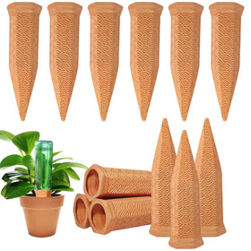 Fosiweelo terracotta watering spike installed in soil delivering slow irrigation.