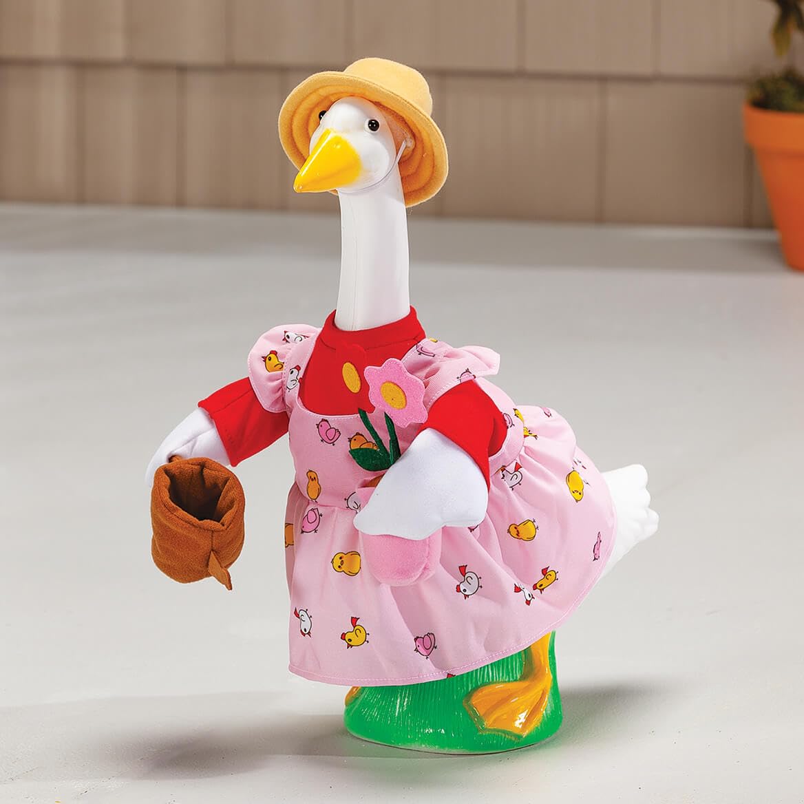 Fox Valley Traders Gaggleville Gardener Baby Goose Flower Pot enhances garden-themed display.