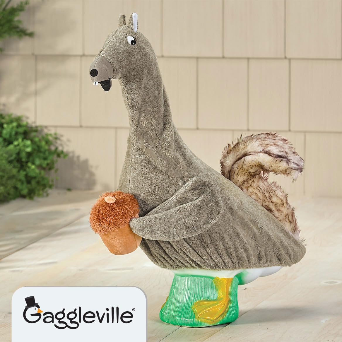 Gaggleville Squirrel Outfit on goose statue, side view, charming outdoor decor