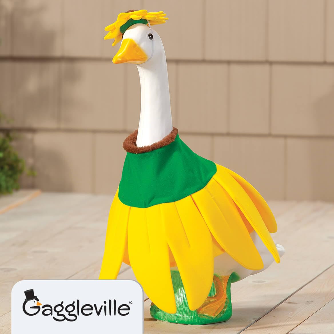 Bright sunflower petals and a mini hat on the goose outfit create a cheerful garden focal point.