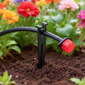 FoxRose ground planter tubing holder securing tubing in planters.