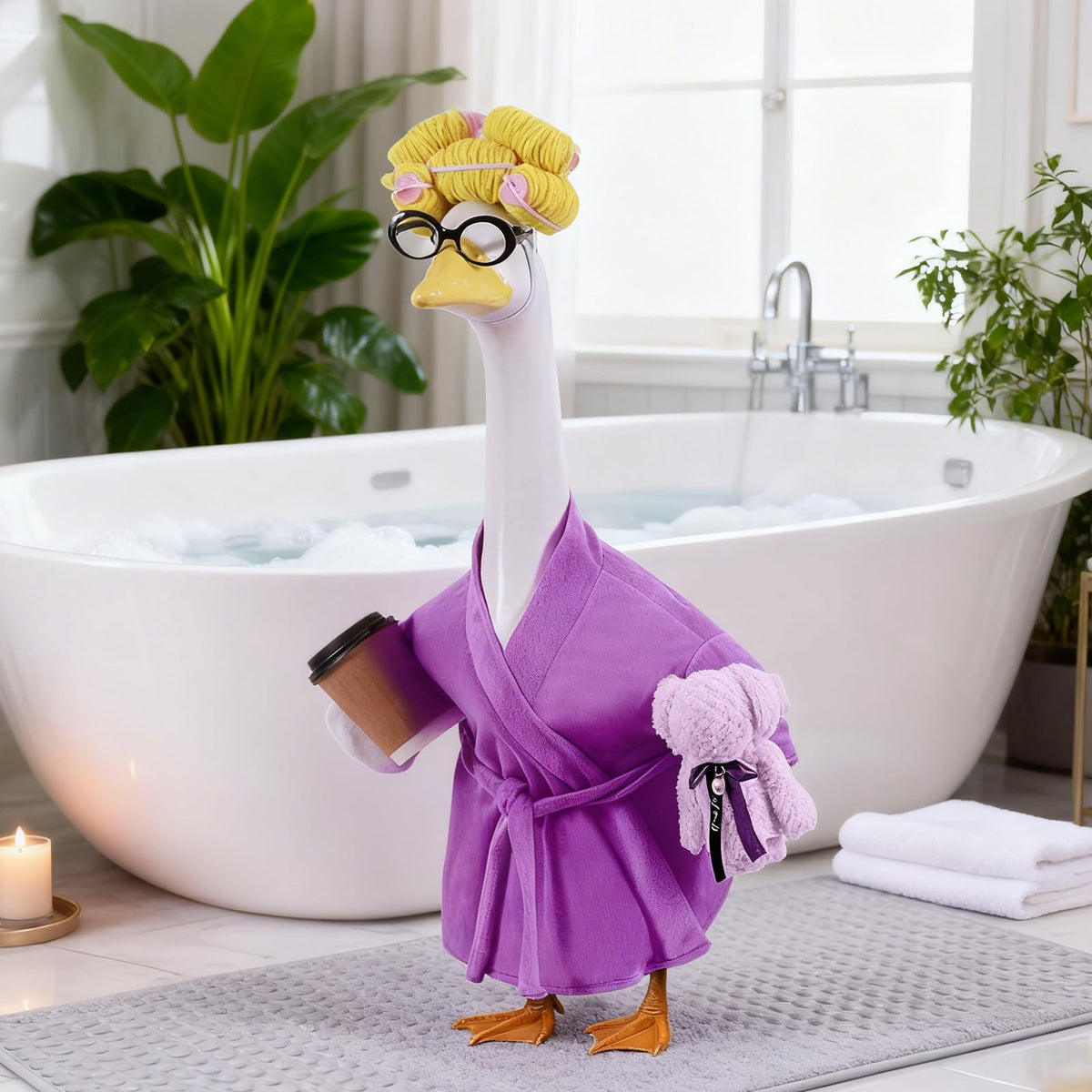 Froklic 23-inch goose statue wearing the outfit in a garden setting