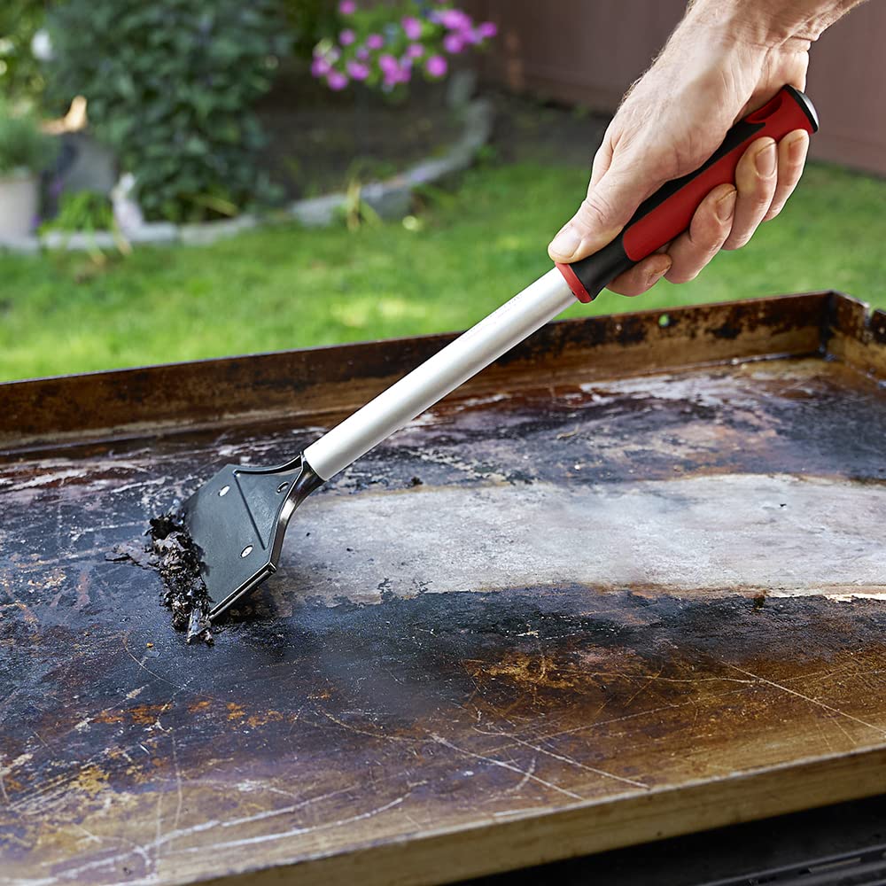 Durable aluminum body of FryOilSaver heavy-duty scraper in use